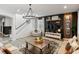 Inviting living room with modern chandelier, cozy seating, and elegant wall decor at 5457 Carrara Ct, St Cloud, FL 34771