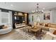 Bright living room with large windows, comfortable seating, and stylish decor at 5457 Carrara Ct, St Cloud, FL 34771