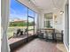Screened patio has a bar-height table with chairs and a great view of the backyard at 5457 Carrara Ct, St Cloud, FL 34771