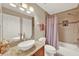 Bathroom featuring a sink with granite countertop and a shower and bathtub combo at 6201 Goethe St # 103, Orlando, FL 32835