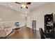 Cozy upstairs bonus room featuring hardwood floors and ample space for leisure activities at 6201 Goethe St # 103, Orlando, FL 32835