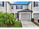 Charming townhome featuring a well-maintained lawn and attached single car garage at 6201 Goethe St # 103, Orlando, FL 32835