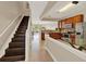 View of the stairs, kitchen, and living room, showcasing the home's layout at 6201 Goethe St # 103, Orlando, FL 32835