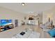 Bright and open living room with tile floors and a view of the dining area and kitchen at 6201 Goethe St # 103, Orlando, FL 32835