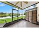View from patio featuring a lake surrounded by green space with outdoor furniture and ceiling fan at 6201 Goethe St # 103, Orlando, FL 32835
