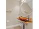 Stylish powder room featuring a vessel sink and modern fixtures at 6201 Goethe St # 103, Orlando, FL 32835
