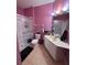 A bathroom with a glass-enclosed shower, toilet, and vanity with a large mirror at 6335 Contessa Dr # 310, Orlando, FL 32829