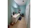 A spacious bathroom featuring a double vanity with a large mirror, and tile floors at 6335 Contessa Dr # 310, Orlando, FL 32829
