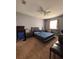 Well-lit bedroom featuring a modern bed frame, ceiling fan, and neutral tones at 6335 Contessa Dr # 310, Orlando, FL 32829