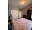 Serene bedroom featuring a floral bedspread, closet, and neutral walls for a calming atmosphere at 6335 Contessa Dr # 310, Orlando, FL 32829