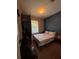 Comfortable bedroom with a floral patterned bedspread, ample closet space and natural light at 6335 Contessa Dr # 310, Orlando, FL 32829