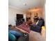 Cozy living room layout with an adjacent dining area, ideal for comfortable living and entertaining at 6335 Contessa Dr # 310, Orlando, FL 32829