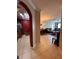 View from the kitchen into the tiled dining and living areas, showcasing an open and airy floor plan at 6335 Contessa Dr # 310, Orlando, FL 32829