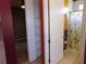 Bathroom with a shower, shelving and access to another bedroom at 7045 Branch Ct, St Cloud, FL 34771