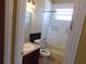 This bathroom offers a tub/shower combo, tile flooring and standard vanity at 7045 Branch Ct, St Cloud, FL 34771
