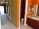 Bright bathroom features a single vanity and toilet at 7045 Branch Ct, St Cloud, FL 34771