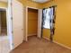 Bedroom with closet and decorative curtains at 7045 Branch Ct, St Cloud, FL 34771