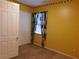 Bedroom with a closet, carpet and decorative curtains at 7045 Branch Ct, St Cloud, FL 34771
