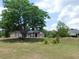 The house features a well-maintained front yard and mature trees at 7045 Branch Ct, St Cloud, FL 34771