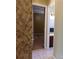 Hallway view of a bedroom and bathroom at 7045 Branch Ct, St Cloud, FL 34771