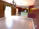 Spacious living area with tile floors, chandelier lighting, and open access to the kitchen at 7045 Branch Ct, St Cloud, FL 34771