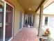The home features a covered patio with tiled floors, creating a comfortable outdoor space at 7045 Branch Ct, St Cloud, FL 34771