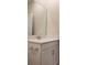 Bathroom featuring a light-filled mirror above a modern white vanity and sink at 725 Ocean Course Ave, Davenport, FL 33896