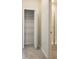 View of the bathroom featuring a large storage closet and a shower with glass doors at 725 Ocean Course Ave, Davenport, FL 33896