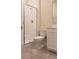This bathroom has a sleek toilet, shower stall with glass door and white vanity at 725 Ocean Course Ave, Davenport, FL 33896