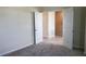 View from the room showcases plush carpet, and an ensuite bathroom in a neutral palette at 725 Ocean Course Ave, Davenport, FL 33896