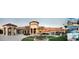 A panoramic view of the clubhouse features a beautiful fountain surrounded by manicured lawns and vibrant palm trees at 725 Ocean Course Ave, Davenport, FL 33896