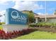 Oasis Clubhouse features manicured lawn, colorful flowers, and lush foliage at 725 Ocean Course Ave, Davenport, FL 33896