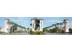 A view of the Champions Gate entrance showcases beautifully landscaped medians and elegant archways at 725 Ocean Course Ave, Davenport, FL 33896