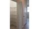 Hallway featuring a walk-in closet and a door leading to another room at 725 Ocean Course Ave, Davenport, FL 33896