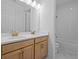 A spacious bathroom with a double vanity, quartz counters, and a separate toilet and shower area at 8018 Colby Cir, Orlando, FL 32817