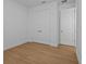 A bright bedroom offers ample closet space and wood-look flooring for a modern feel at 8018 Colby Cir, Orlando, FL 32817
