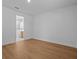 A bedroom with wood-look floors and natural light is ready for your personal touch at 8018 Colby Cir, Orlando, FL 32817