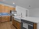 Beautiful kitchen featuring a large island, stainless steel appliances, and stylish wood cabinetry at 8018 Colby Cir, Orlando, FL 32817