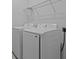 Modern laundry room showcasing a new washer and dryer at 8018 Colby Cir, Orlando, FL 32817