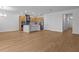 Spacious living room with stainless steel appliances, and stylish wood cabinetry at 8018 Colby Cir, Orlando, FL 32817