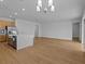 Spacious living room with stainless steel appliances, and stylish wood cabinetry at 8018 Colby Cir, Orlando, FL 32817