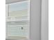 Close up on the window, featuring white blinds at 8018 Colby Cir, Orlando, FL 32817