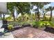 Beautiful backyard with a brick paver patio, raised garden beds, and mature trees at 803 Arlington Blvd, Altamonte Springs, FL 32701