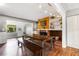 Dining area with wooden table and built-in shelves with wood paneling over the fireplace at 803 Arlington Blvd, Altamonte Springs, FL 32701