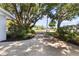 Long driveway framed by mature trees and landscaping, adding curb appeal at 803 Arlington Blvd, Altamonte Springs, FL 32701