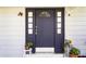 Elegant blue front door with sidelights, enhancing the home's curb appeal at 803 Arlington Blvd, Altamonte Springs, FL 32701