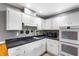 Bright kitchen features white cabinetry, black appliances and gray walls at 803 Arlington Blvd, Altamonte Springs, FL 32701