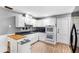 Functional kitchen with white cabinets and stainless steel appliances at 803 Arlington Blvd, Altamonte Springs, FL 32701