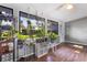 Bright sun room with wood flooring and multiple windows overlooking the backyard at 803 Arlington Blvd, Altamonte Springs, FL 32701