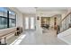 Spacious foyer features tile flooring, a staircase, and natural light at 8439 Prestbury Dr, Orlando, FL 32832